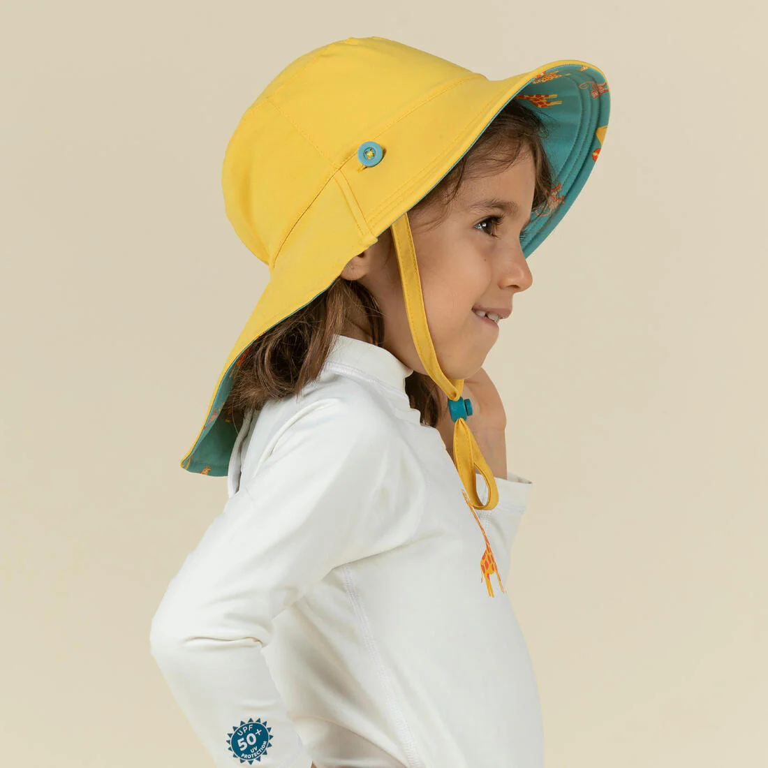 Sombrero bebé filtro UV reversible amarillo azul con estampado selva - Image 7